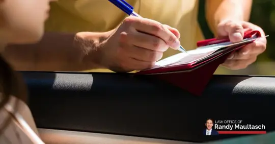 officer writing a traffic ticket